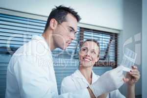 Dentists looking at x-ray