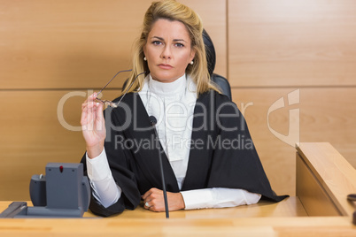 Stern judge looking at camera