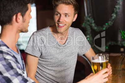 Happy friends catching up over pints