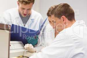 Science students using incubator in the lab