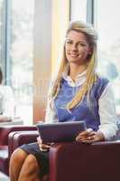 Smiling businesswoman with digital tablet