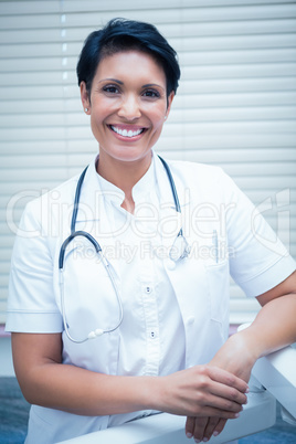 Confident smiling female dentist