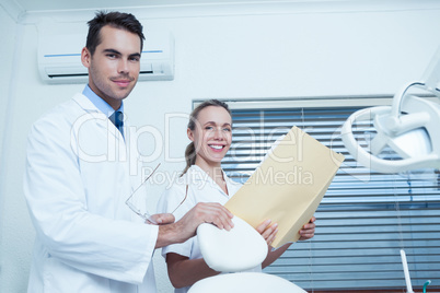 Portrait of dentists with reports