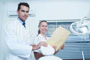 Portrait of dentists with reports