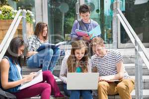 Students sitting on steps studying