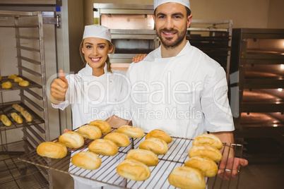 Team of bakers smiling at camera