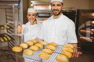Team of bakers smiling at camera