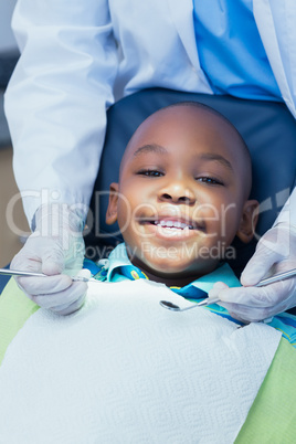 Close up of boy having his teeth examined