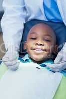 Close up of boy having his teeth examined