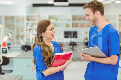 Young medical students smiling at each other Young medical students smiling at each other