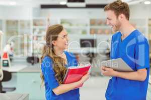 Young medical students smiling at each other