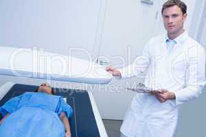 Doctor proceeding a radiography on a patient