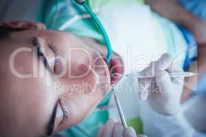 Close up of man having his teeth examined