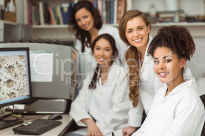 Science students smiling at camera