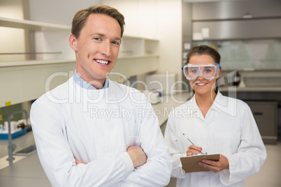 Team of pharmacists smiling at camera