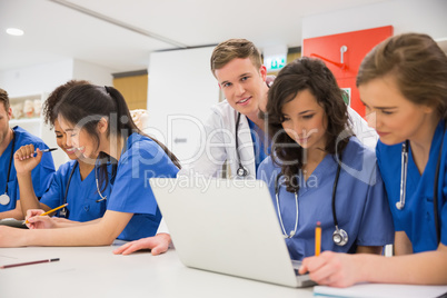 Medical student smiling at the camera during class
