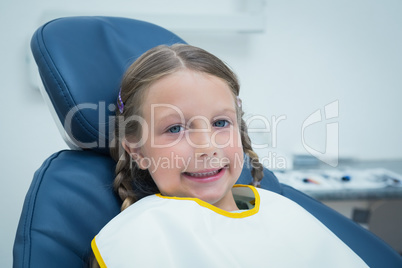 Smiling girl waiting for dental exam
