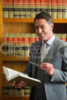 Lawyer reading book in the law library