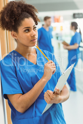 Medical student thinking in hallway