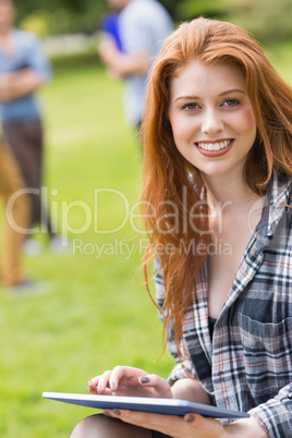 Pretty student studying outside on campus