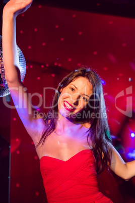 Pretty brunette dancing and smiling