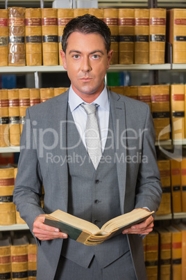 Lawyer reading book in the law library