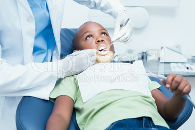 Close up of boy having his teeth examined