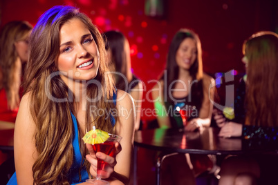 Pretty blonde drinking a cocktail