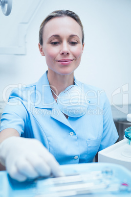 Smiling young female dentist