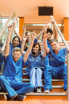 Medical students cheering on the steps