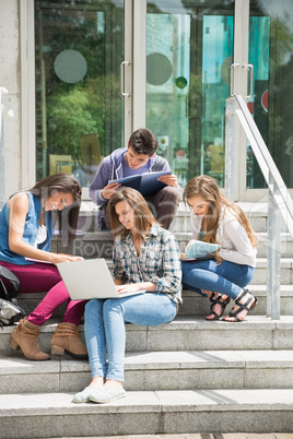 Students sitting on steps studying