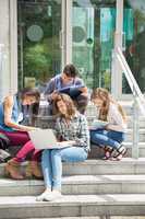 Students sitting on steps studying