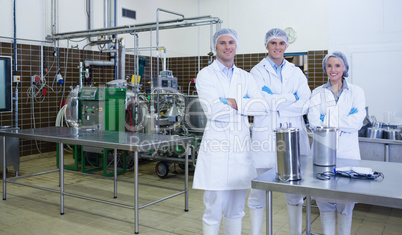 Biologist team with arms crossed smiling at camera