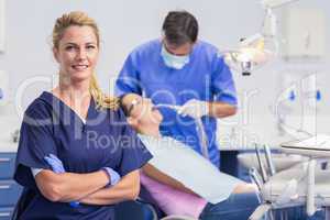 Portrait of a smiling nurse her arms crossed