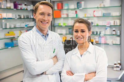 Team of pharmacists smiling at camera