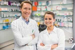 Team of pharmacists smiling at camera