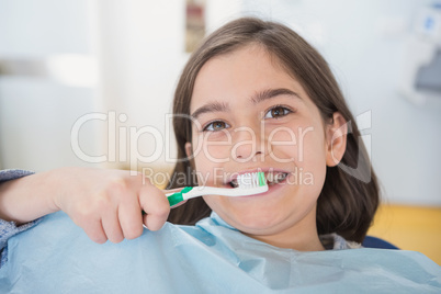 Smiling young patient holding touthbrush