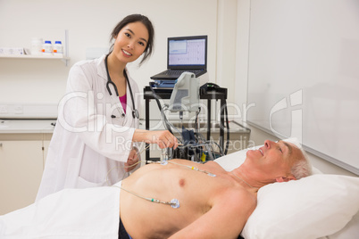 Medical student practicing on older man