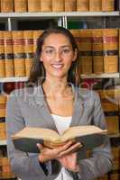 Lawyer reading book in the law library