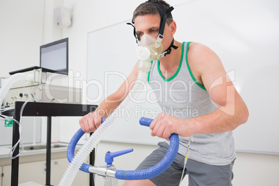 Man doing fitness test on exercise bike