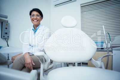 Portrait of smiling female dentist