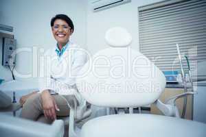 Portrait of smiling female dentist