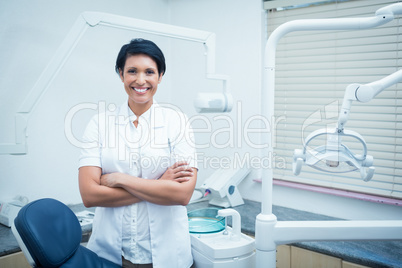 Female dentist with arms crossed