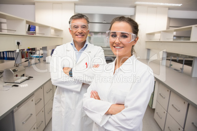 Team of pharmacists smiling at camera