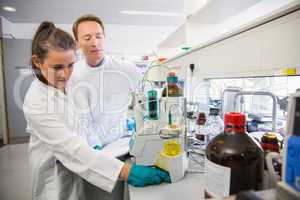 Young scientists conducting an experiment together