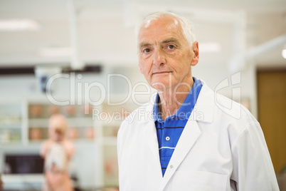 Senior scientist looking at camera