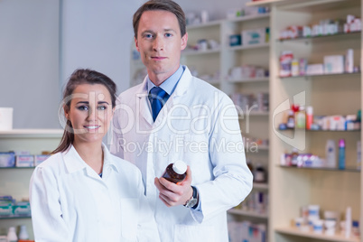 Pharmacist showing medication to his trainee