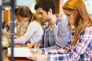 Four focused classmates working together