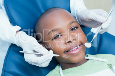 Close up of boy having his teeth examined