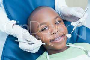 Close up of boy having his teeth examined